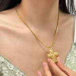 Elegant Gold-Tone Cross Pendant Necklace - Image 2